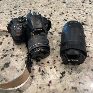 Nikon D3400 DSLR Camera with 18-55mm & 70-300mm lenses.